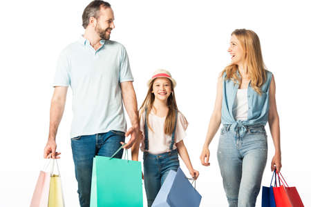 happy family with colorful shopping bags isolated on whiteの写真素材
