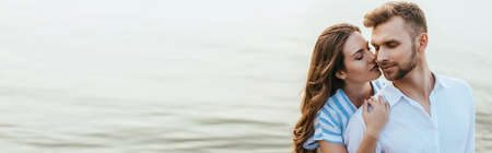 website header of attractive woman hugging handsome man with closed eyes near river