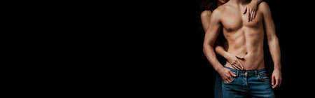 Panoramic orientation of woman touching torso of boyfriend isolated on black