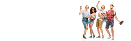 Panoramic shot of multiethnic students holding books and coffee to go on white backgroundの写真素材