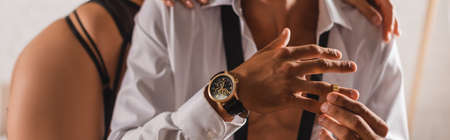 Panoramic shot of man taking off wedding ring near sexy womanの写真素材