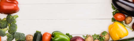 top view of fresh ripe vegetables and fruits on wooden white background, panoramic shotの写真素材