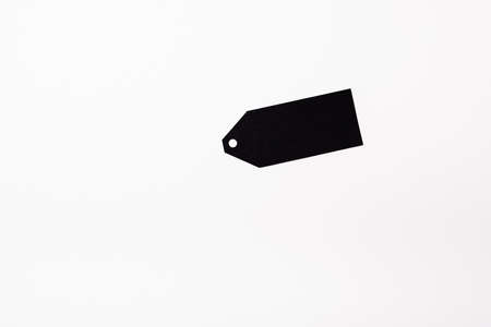 Top view of black empty price tag on white background