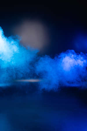 blue dark background with smoke and copy spaceの写真素材