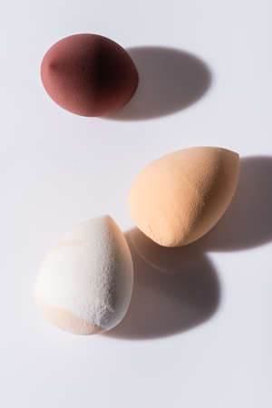 top view of makeup sponges on white backgroundの写真素材