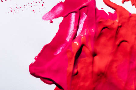 top view of pink lipstick brushstrokes on white backgroundの写真素材