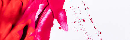 top view of pink lipstick brushstrokes on white background, panoramic shotの写真素材