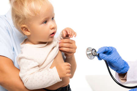 Pediatrician holding stethoscope near child and father isolated on whiteの写真素材