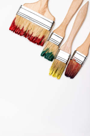top view of dirty paintbrushes on white backgroundの写真素材