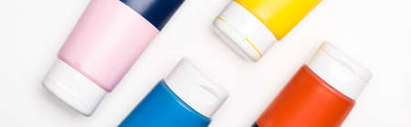 top view of acrylic paint tubes on white background, panoramic shotの写真素材