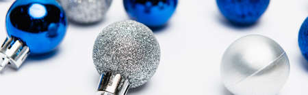 blue, silver Christmas decoration on white background, banner