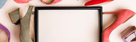 top view of heeled shoes and empty frame on white background, bannerの写真素材