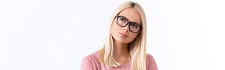 Thoughtful woman in eyeglasses looking away isolated on white, banner