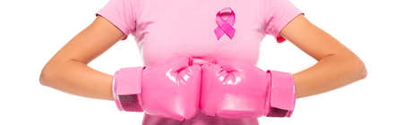 Cropped view of woman in boxing gloves and pink ribbon of breast cancer awareness isolated on white, bannerの写真素材