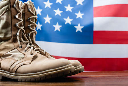 army boots near american flag on blurred backgroundの写真素材