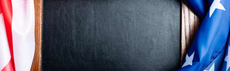 top view of blank chalkboard near flag of american with stars and stipes, banner