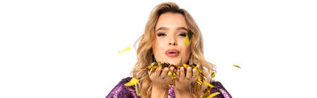happy elegant woman in sequin dress blowing confetti isolated on white, bannerの写真素材
