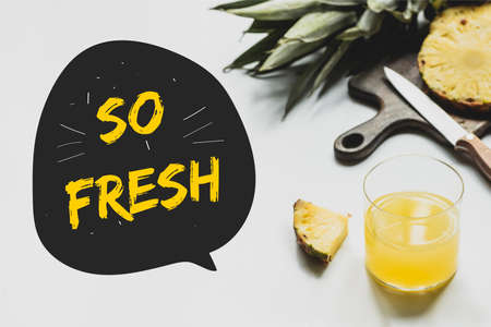 delicious pineapples on wooden cutting board with knife near glass of orange juice and so fresh...