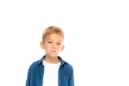 Serious child looking at camera isolated on white