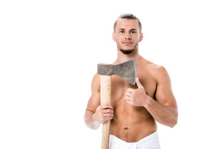 sexy shirtless man in towel posing with ax isolated on whiteの写真素材