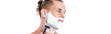 man with foam on face shaving isolated on white, bannerの写真素材