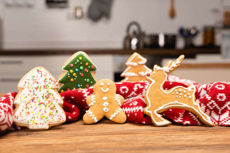 winter gingerbread cookies and scarf on wooden backgroundの写真素材