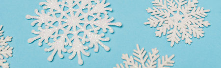 top view of winter snowflakes on blue background, bannerの写真素材