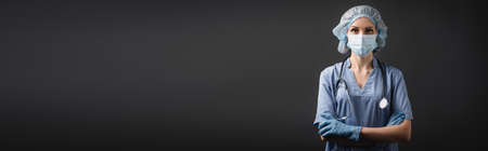 nurse in medical mask and latex gloves standing with crossed arms isolated on dark gray, banner