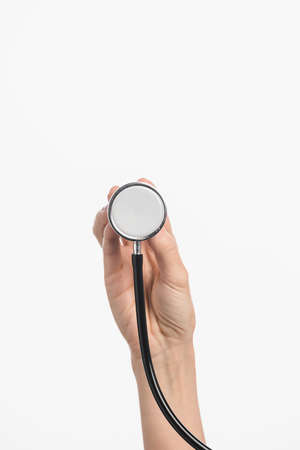 cropped view of nurse holding stethoscope isolated on whiteの写真素材
