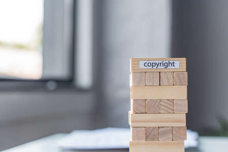 Blocks wood tower game with copyright lettering on blurred background