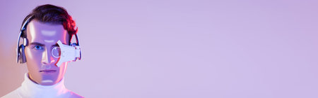 Portrait of cyborg in headphones and digital eye lens on purple background, bannerの写真素材