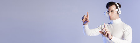 Cyborg man in eye lens and headphones touching something isolated on purple, bannerの写真素材