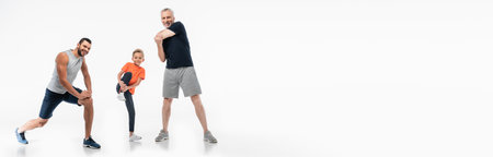 happy boy with father and grandpa in sportswear warming up on white, bannerの写真素材