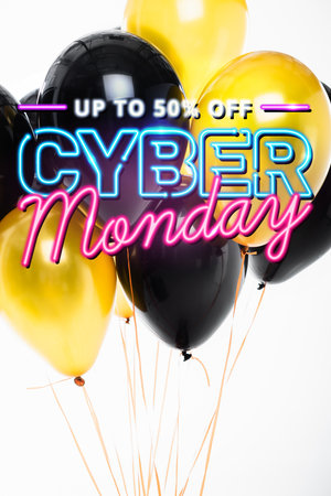 Festive black and golden balloons near up to 50 percent off, cyber monday lettering on whiteの写真素材