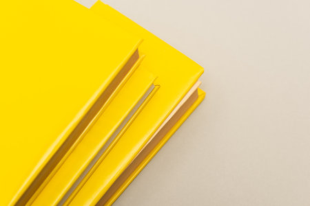 yellow copy books isolated on gray with copy space