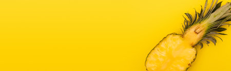 top view of half of ripe and fresh pineapple isolated on yellow, banner