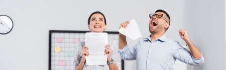 excited business people holding documents with contract in office, banner