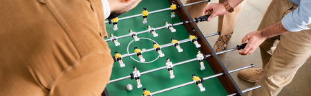 Cropped view of business people playing table soccer, banner