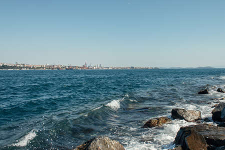 Wet stones and sea waves on coast