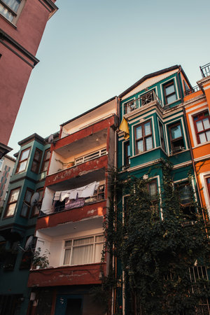 old buildings with green ivy and laundry on balconies in Jewish quarter, Istanbul, Turkeyの写真素材