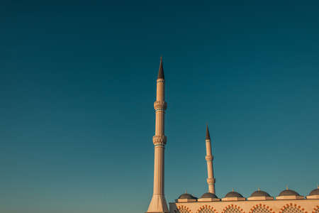 blue, cloudless sky over high minarets of Mihrimah Sultan Mosque, Istanbul, Turkeyの写真素材