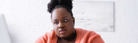 african american plus size woman at home, bannerの写真素材