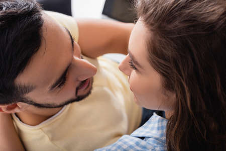 high angle view of interracial couple looking at each other