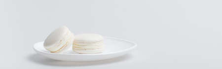 delicious macarons on plate isolated on white, bannerの写真素材
