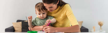 Mother and kid drawing at home, bannerの写真素材