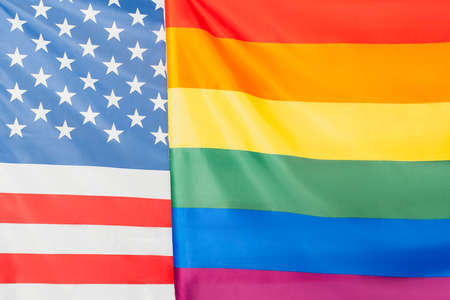 close up of american and lgbt flags, equality rights conceptの写真素材