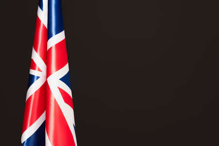 national flag of united kingdom with red cross isolated on black with copy spaceの写真素材