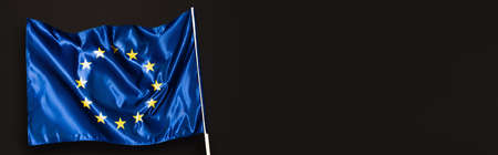 blue european union flag isolated on black, bannerの写真素材