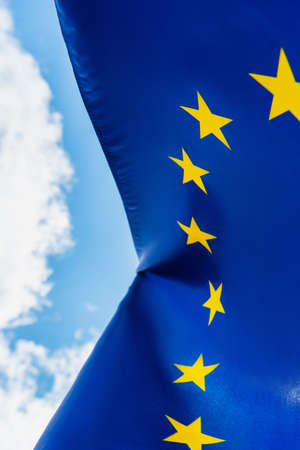 bottom view of european union flag against skyの写真素材