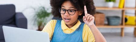 African american girl having idea during online education at home, bannerの写真素材